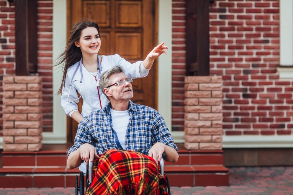 A young girl with disable old man